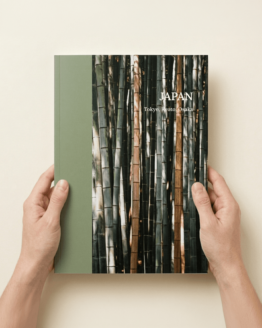Several photo books in different sizes arranged on a table for comparison