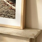 Close-up corner detail of a Classic Framed Print in natural wood frame