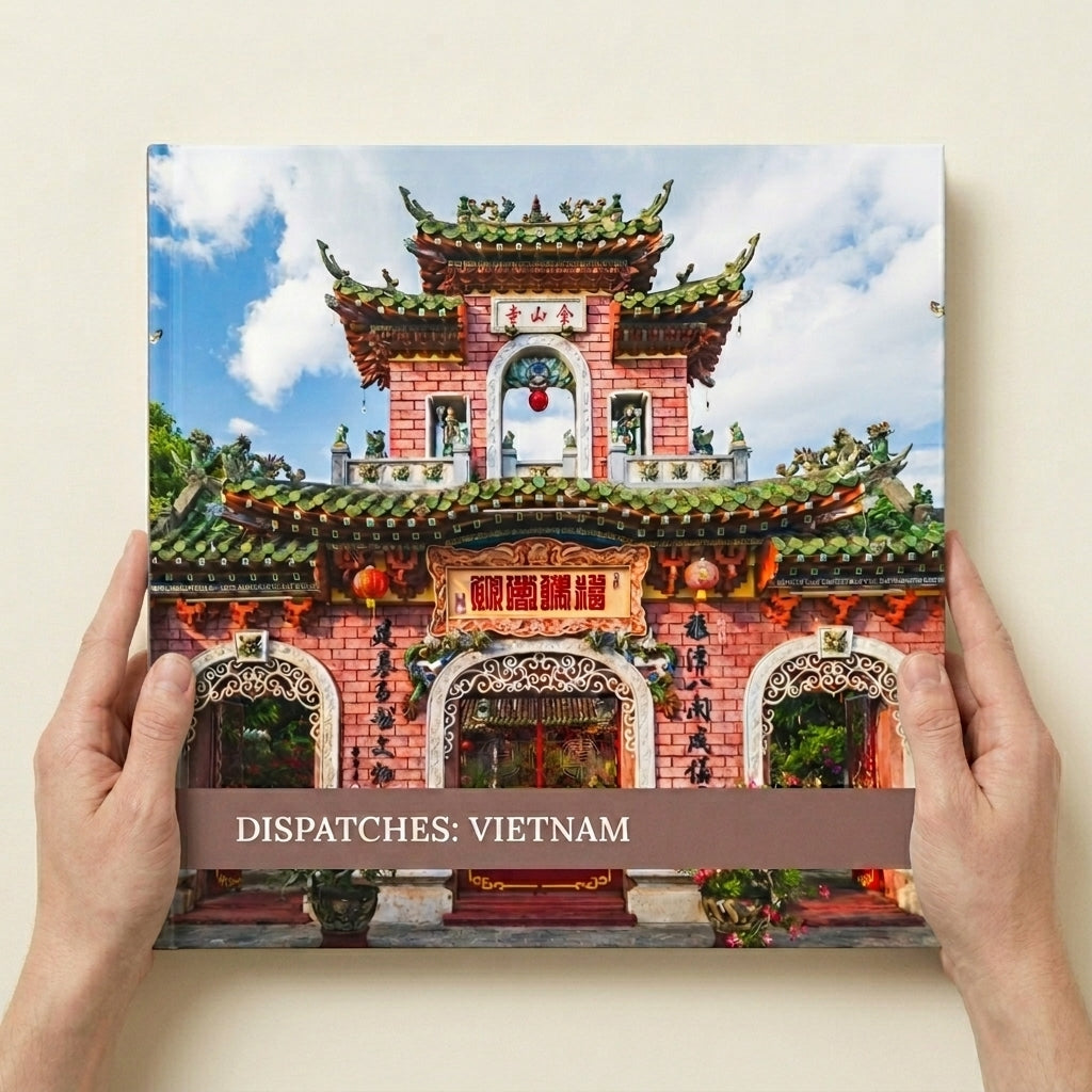 Layflat Edition photo book in 12-inch square held in hands to show physical size