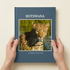 Premium Hardcover photo book in A4 portrait held in hands to show physical size