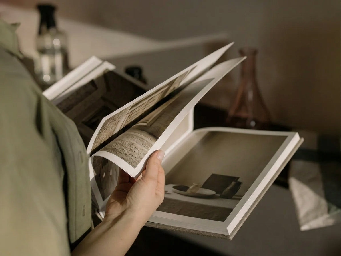 People reviewing a premium hardcover photo book