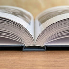 Close-up of the Premium Hardcover photo book spine showing PUR binding and matte finish