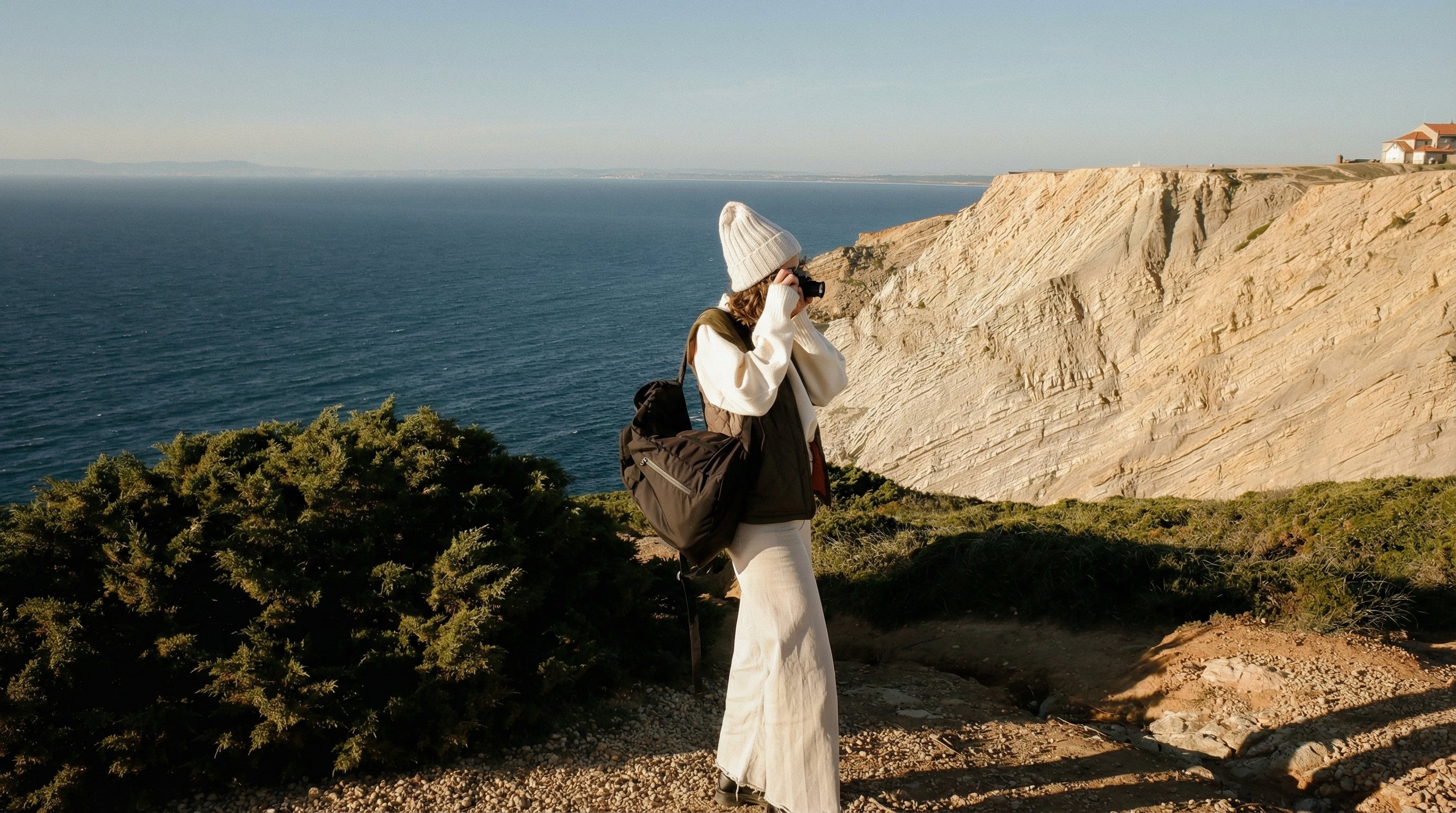 Bride standing in a landscape with bouquet